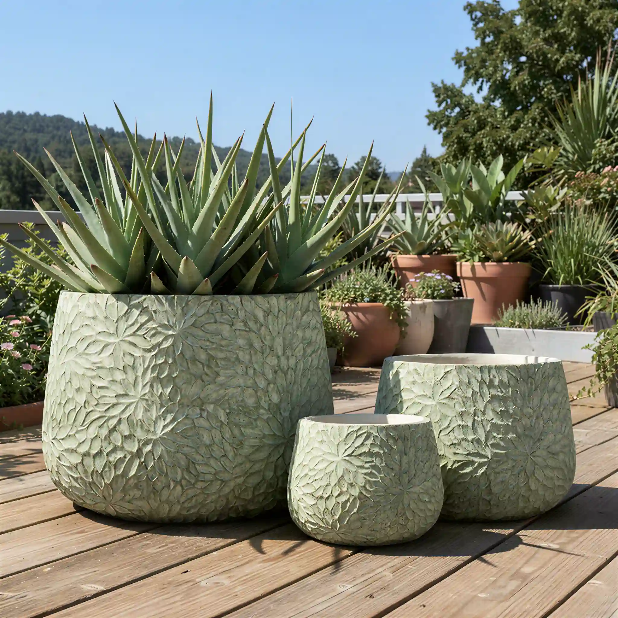 Rounded dark RCW-4019 GFRC patio planters arranged in an open-air commercial atrium
